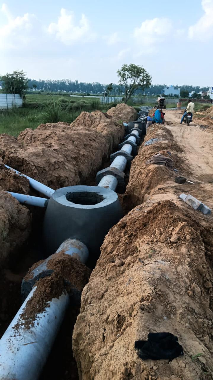 Sewer pipeline and manhole chambers laid in an open trench